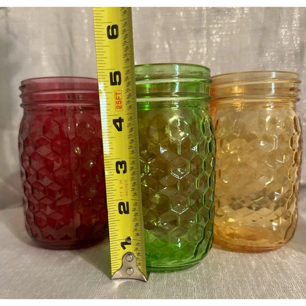 Set of 4 modern, colorful glass jars w/ hexagon stamped pattern